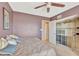 Comfortable bedroom featuring a ceiling fan and organized closet space with shelving at 4939 Floramar Ter # 504, New Port Richey, FL 34652