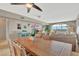 Open concept room with dining table and cozy living room featuring a large window and comfortable seating at 4939 Floramar Ter # 504, New Port Richey, FL 34652