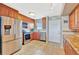 This well-appointed kitchen features stainless steel appliances, wood cabinets, and ample counter space at 4939 Floramar Ter # 504, New Port Richey, FL 34652