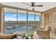 Relaxing lanai with comfortable seating and expansive views of the marina at 4939 Floramar Ter # 504, New Port Richey, FL 34652