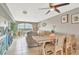 Cozy living room and dining area with water views and abundant natural light at 4939 Floramar Ter # 504, New Port Richey, FL 34652