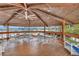 Outdoor patio featuring dining tables, chairs, a ceiling fan, and marina views at 4939 Floramar Ter # 504, New Port Richey, FL 34652