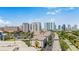 Aerial shot of condo complex with a cityscape backdrop and lush green landscaping at 501 Knights Run Ave # 1335, Tampa, FL 33602