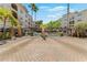 Community security gate with brick pillars and secure access control for resident privacy and safety at 501 Knights Run Ave # 1335, Tampa, FL 33602