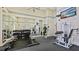 Well-equipped gym featuring weights, strength training machines, and a mirrored wall at 501 Knights Run Ave # 1335, Tampa, FL 33602