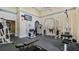 Modern fitness center with various exercise machines and mounted TV at 501 Knights Run Ave # 1335, Tampa, FL 33602