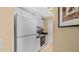 Compact kitchen featuring white cabinets, black countertops, and modern appliances for efficient meal preparation at 501 Knights Run Ave # 1335, Tampa, FL 33602