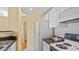Bright kitchen features white cabinets and appliances and a neutral backsplash at 501 Knights Run Ave # 1335, Tampa, FL 33602