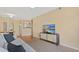 Bright living room featuring hardwood floors, stylish furniture, and open access to the kitchen area at 501 Knights Run Ave # 1335, Tampa, FL 33602
