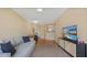 Cozy living room featuring hardwood floors, stylish furniture, and open access to the kitchen and dining area at 501 Knights Run Ave # 1335, Tampa, FL 33602