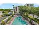 Inviting outdoor pool area with plenty of lounge chairs surrounded by lush landscaping at 501 Knights Run Ave # 1335, Tampa, FL 33602