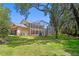 Expansive screened-in patio with a pool offers the ultimate outdoor living space at 5017 Muir Way, Lithia, FL 33547