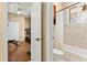 Bathroom view showcasing the shower/tub and exercise room at 5017 Muir Way, Lithia, FL 33547