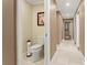 Bathroom with toilet and view of hallway at 5017 Muir Way, Lithia, FL 33547