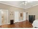 Spacious bedroom featuring hardwood floors and ensuite bathroom at 5017 Muir Way, Lithia, FL 33547