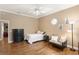 Relaxing bedroom with a twin bed, ceiling fan, and natural lighting at 5017 Muir Way, Lithia, FL 33547