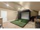 Carpeted room with a golf simulator, offering indoor sports fun at 5017 Muir Way, Lithia, FL 33547