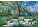 Relaxing park area with benches, lush greenery, and walking paths at 5017 Muir Way, Lithia, FL 33547