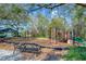 Fun playground area with swings, climbing structures, and a comfortable bench at 5017 Muir Way, Lithia, FL 33547