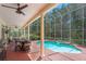Screened-in pool and patio area with outdoor dining and grilling space; perfect for entertaining at 5017 Muir Way, Lithia, FL 33547