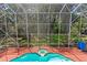 An aerial view of a screened in pool and brick patio at 5017 Muir Way, Lithia, FL 33547