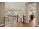 Upstairs foyer featuring a decorative chandelier and decorative staircase at 5017 Muir Way, Lithia, FL 33547