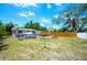 Backyard with patio, seating, above ground pool and mature landscaping at 5365 Flamingo Dr, St Petersburg, FL 33714
