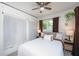 Charming bedroom with built-in storage, cozy bedding, and ample natural light at 5365 Flamingo Dr, St Petersburg, FL 33714
