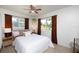 Inviting bedroom with plush bed, natural light, and warm accents creates a serene atmosphere at 5365 Flamingo Dr, St Petersburg, FL 33714