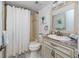 Cozy bathroom featuring a tub-shower combo and neutral décor with a modern vanity at 5736 La Puerta Del Sol S Blvd # 254, St Petersburg, FL 33715