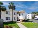 Exterior of building showing walkways, stairs, landscaping, and convenient parking at 5736 La Puerta Del Sol S Blvd # 254, St Petersburg, FL 33715