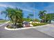 Welcome to La Puerta Del Sol, a beautiful community entrance with lush landscaping and vibrant floral displays at 5736 La Puerta Del Sol S Blvd # 254, St Petersburg, FL 33715