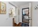 Bright entryway leading to a view of the balcony and a glimpse of the updated kitchen with modern appliances at 5736 La Puerta Del Sol S Blvd # 254, St Petersburg, FL 33715