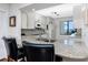 Bright kitchen features granite countertops, stainless steel sink, and an open pass-through at 5736 La Puerta Del Sol S Blvd # 254, St Petersburg, FL 33715