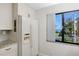 Clean, white kitchen with a view of the outdoors at 5736 La Puerta Del Sol S Blvd # 254, St Petersburg, FL 33715