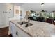 This kitchen features granite countertops and stainless steel sink with views to living area at 5736 La Puerta Del Sol S Blvd # 254, St Petersburg, FL 33715