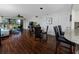 Open living and dining area featuring hardwood floors and a view of the outdoor patio at 5736 La Puerta Del Sol S Blvd # 254, St Petersburg, FL 33715