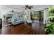 Bright living room with stylish decor, hardwood floors, and a sliding glass door to the patio at 5736 La Puerta Del Sol S Blvd # 254, St Petersburg, FL 33715