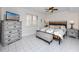 Relaxing bedroom features a ceiling fan, tile floors, and bright windows with lovely decor at 5736 La Puerta Del Sol S Blvd # 254, St Petersburg, FL 33715