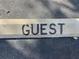 Close up of the parking space painted with the word 'GUEST' at 5736 La Puerta Del Sol S Blvd # 254, St Petersburg, FL 33715