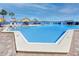 Inviting community pool perfect for relaxation, surrounded by lounge chairs and offering bay views at 5736 La Puerta Del Sol S Blvd # 254, St Petersburg, FL 33715