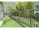 Fenced backyard with lush green lawn, perfect for entertaining and relaxation at 614 Fayette S Dr, Safety Harbor, FL 34695