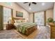 Bedroom with decorative rug, a wood bed frame, and an ensuite door leading to the patio at 614 Fayette S Dr, Safety Harbor, FL 34695