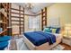 Bedroom with built-in shelves and stylish decor provides ample space for relaxation and personalization at 614 Fayette S Dr, Safety Harbor, FL 34695