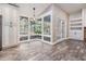 Breakfast nook with natural lighting, modern light fixture and view to the screened porch at 614 Fayette S Dr, Safety Harbor, FL 34695