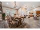 Dining room with table and chairs, with hardwood flooring and neutral color scheme, leading into living room at 614 Fayette S Dr, Safety Harbor, FL 34695
