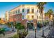 Attractive commercial building with a restaurant, complemented by palm trees and outdoor seating in a sunny setting at 614 Fayette S Dr, Safety Harbor, FL 34695