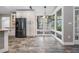 Bright kitchen with white cabinets, stainless steel appliances, eat in area and lots of natural light at 614 Fayette S Dr, Safety Harbor, FL 34695
