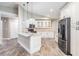 Well-appointed kitchen featuring granite countertops, white cabinetry, and stainless steel appliances at 614 Fayette S Dr, Safety Harbor, FL 34695