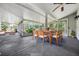 Outdoor patio with seating area and a dining table under a screened roof at 614 Fayette S Dr, Safety Harbor, FL 34695